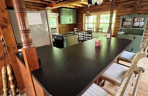 Harwich House | Relax in a tranquil log home on direct lake front property. The Hermitage awaits