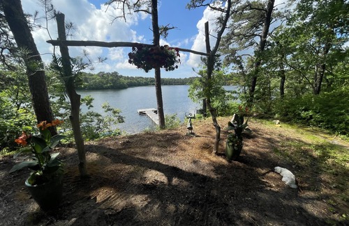Harwich House | Relax in a tranquil log home on direct lake front property. The Hermitage awaits