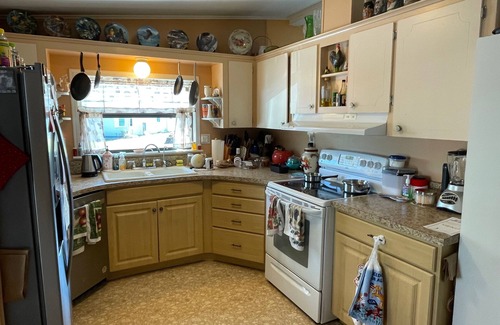Wildwood House | Relax in style—lanai, golf cart & tranquil wooded views included!