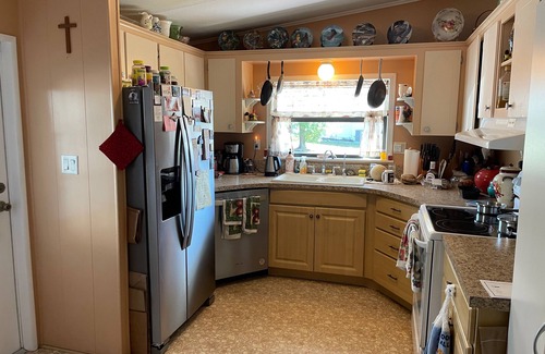 Wildwood House | Relax in style—lanai, golf cart & tranquil wooded views included!