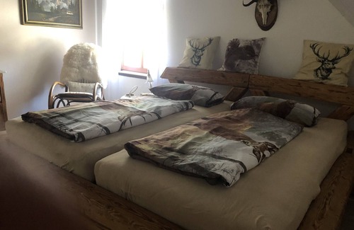 Tettnang Apartment | Relax in the large beamed bed/dream room. Guest room
