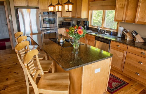 Egg Harbor House | Relax or do nothing at all high on the bluff with water views second to none.