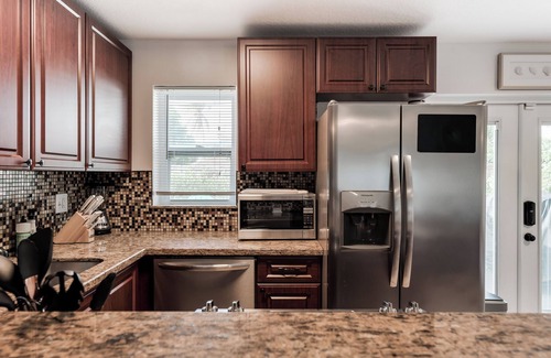 Hunt Club House | Relax & Recharge: Saltwater Pool + Lush Backyard Oasis in Palm Beach Gardens