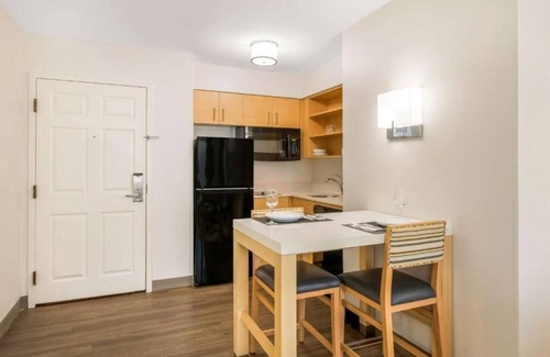 Arrowood Hotel | Relaxed and Roomy Suite with Fitness Center Near NASCAR Hall of Fame – 6 Miles