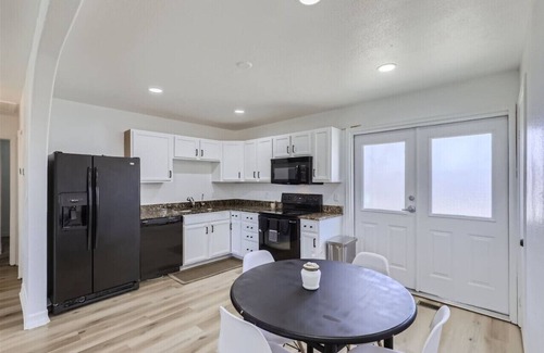 Montbello House | Remodeled 4BR Home: 2 Kitchens, Big Yard, Firepit, Near Downtown
