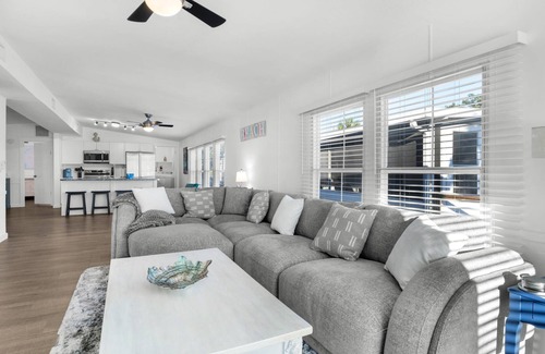 Bayside Park House | Renovated canal-front pet-friendly home with a fireplace and boat dock, steps away from the marina!