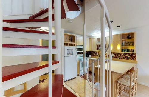Alyeska Condo | Renovated condo with mountain views, fireplace & spiral staircase - walk to lift