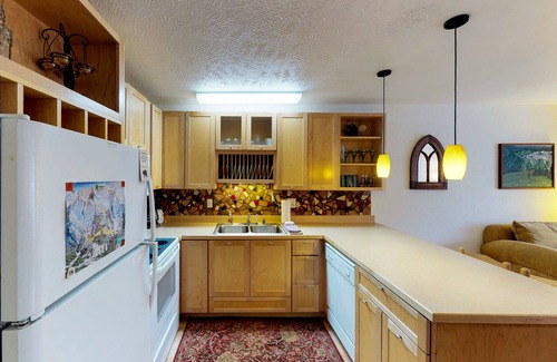 Alyeska Condo | Renovated condo with mountain views, fireplace & spiral staircase - walk to lift