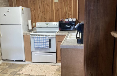 Hardy Condo | Renovated historical hotel. Now a full size condo with game room & balcony.