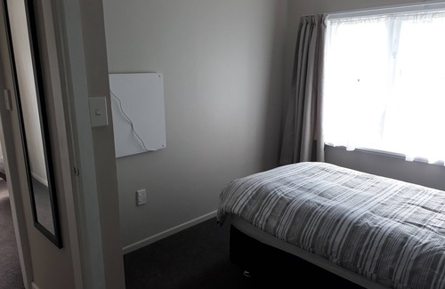 Otaki House | Renovated house set amongst mature trees