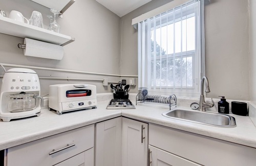 Arvada Apartment | Retro Chic Micro-studio in Heart of Downtown Olde Town Arvada | 85 Walk Score