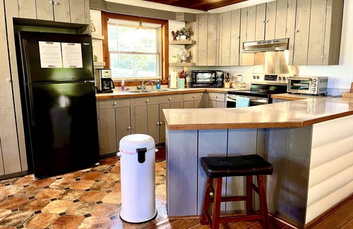 Cross Plains Cabin | "River House" Log Cabin Nestled near the Red River