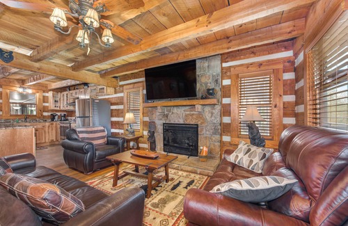 Sevierville Cabin | River-View Home w/Multi-Level Deck, Yard, Hot Tub, & Free Attraction Tickets