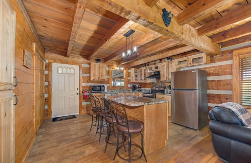 Sevierville Cabin | River-View Home w/Multi-Level Deck, Yard, Hot Tub, & Free Attraction Tickets
