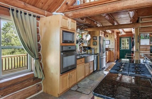 South Boardman House | Riverfront Beach Lodge Home in the Heart of Snowmobile Trails