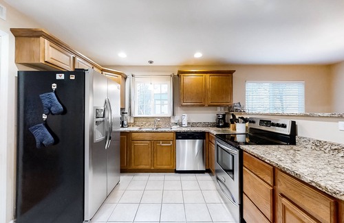 Whittier House | Riverfront gem w/wraparound deck, horseshoes, firepit, hot tub, WiFi - 2 dogs OK