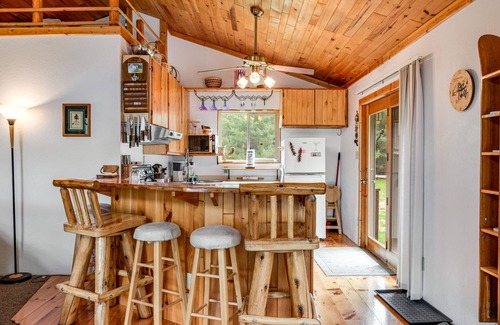 Eagle River House | Riverfront home with private dock, kayaks, views, firepit, cornhole & foosball