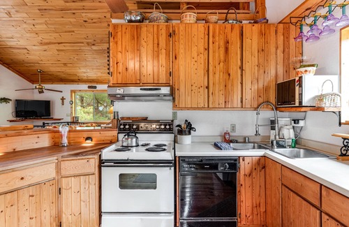 Eagle River House | Riverfront home with private dock, kayaks, views, firepit, cornhole & foosball