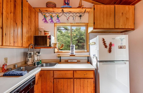 Eagle River House | Riverfront home with private dock, kayaks, views, firepit, cornhole & foosball
