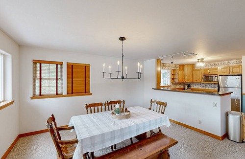 Sandpoint Cabin | Riverfront home with mountain view, hot tub, deck, WiFi, W/D, & fireplace
