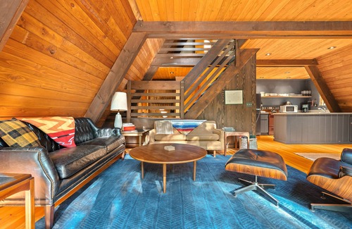 Rhododendron Cabin | Riverside A-frame in gated cabin community with private deck, woodstove, & W/D