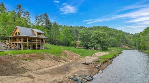 Warrensville House | Riverstead Cabin- Riverfront, Wrap Around Porch, Hot Tub & More