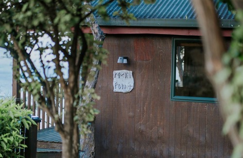 Nelson Region Cabin | Rocky Point Hut Pepin Island is nestled amongst native kanuka and coastal New Zealand bush