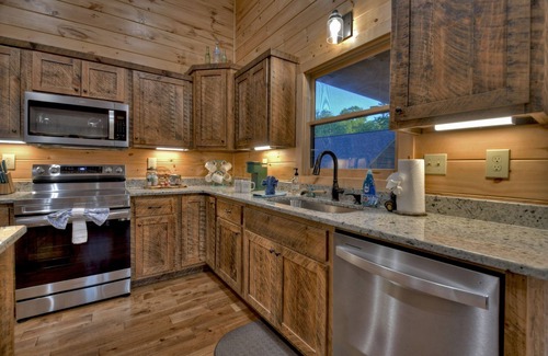 Mineral Bluff Cabin | Rohring Retreat - Bask in comfort on the deck and play games in the game room!