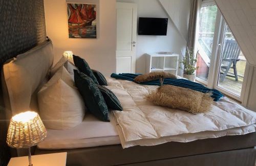 Pruchten Apartment | romantisches Ferienhaus Boddenblick mit Sauna