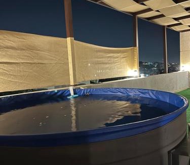 Amman Apartment | Rooftop pool with terraces F-R