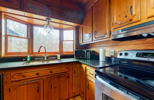 Oakman House | Roomy, three-story mountain home with two full kitchens, game rooms, & AC