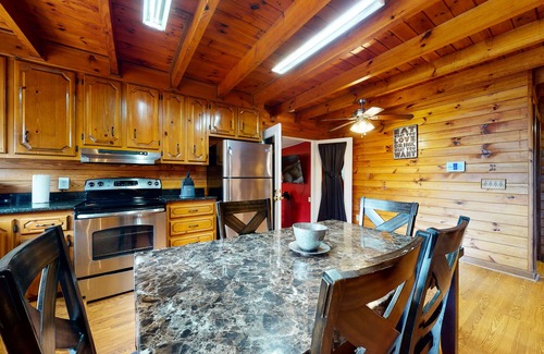 Oakman House | Roomy, three-story mountain home with two full kitchens, game rooms, & AC