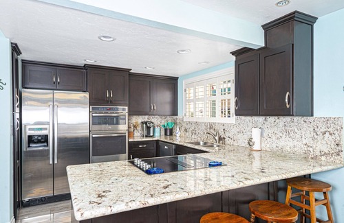 West Newport Condo | Roomy Vacation Home Steps from the Beach | Large Patio w/Firepit and Ocean Views | Walk to it All!