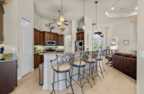 Cape Coral House | Royal Sereni Tee - Cape Royal Golf Community