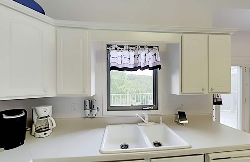 Stonecrest House | Rumbling Bald Resort getaway with 2 living areas, foosball & golf course views
