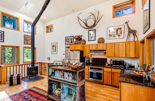 Harrison House | Rustic-modern home in forest overlooking Lake Coeur d’Alene with W/D & AC