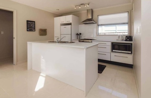 New Plymouth Apartment | Sail-Shaped Townhouse in New Plymouth