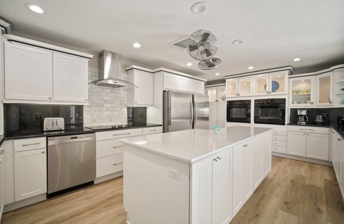 Bal Harbour House | Saltwater canal front 4 bedroom tropical home with private pool and boat dock