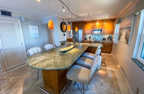 Punta Rassa Condo | Sanibel Harbour 817: Wrap-around lanai-Amazing Water Views! Enjoy private beach &activities nearby.