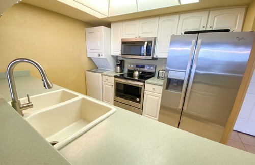 Punta Rassa Condo | Sanibel Harbour Resort Harbour Tower 315: Relaxing while watching for dolphins in the water below.