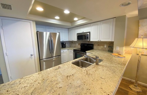 Punta Rassa Condo | Sanibel Harbour Resort: Bay View Tower 1036 Beachfront vacation retreat overlooking the water