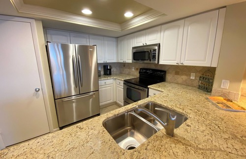 Punta Rassa Condo | Sanibel Harbour Resort: Bay View Tower 1036 Beachfront vacation retreat overlooking the water