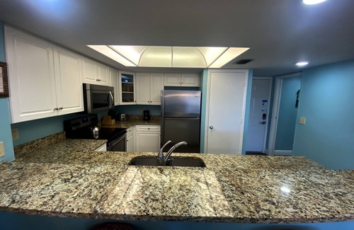 Punta Rassa Condo | Sanibel Harbour Resort: Bay View Tower 231: Beachfront Condo with pool and water views
