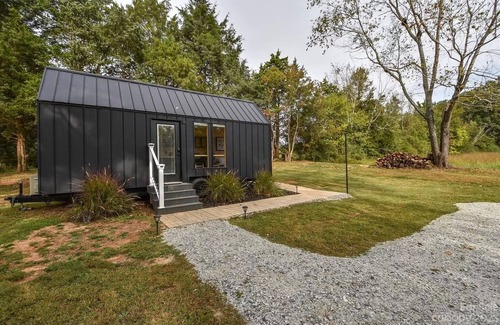 Salisbury Apartment | Scandinavian tiny home surrounded by nature with patio, solo fire pit, grill.