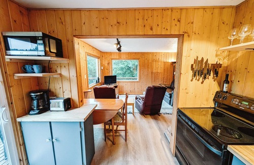 Gold Beach Cottage | Scenic River Retreat w/Deck View Lawn Games Wood Stove