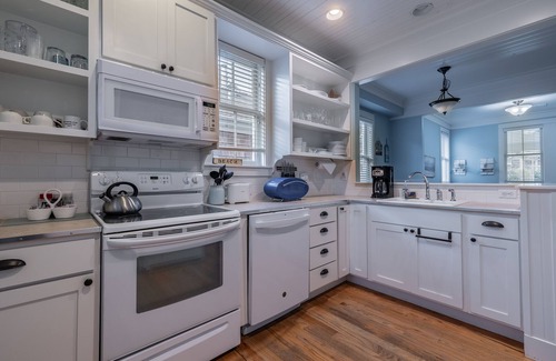 Seabrook House | Seabrook's Cape Escape a cozy 2-bedroom home with a covered porch!