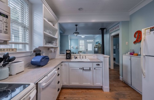 Seabrook House | Seabrook's Cape Escape a cozy 2-bedroom home with a covered porch!