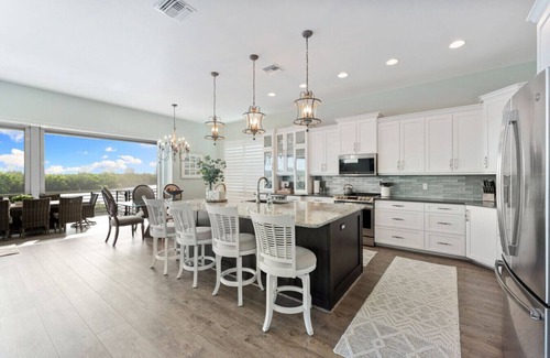 Bonita Springs House | Seafoam Serenity - Bayfront Retreat w/Dock, Pool & 1 Min Walk to Bonita Beach