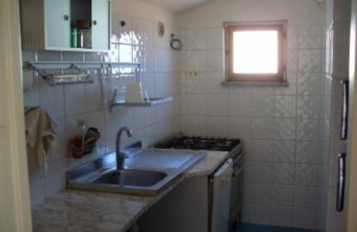 Santa Teresa di Gallura Apartment | Seaview cozy penthouse 300m walk to the beach, large terrace. Center Village.