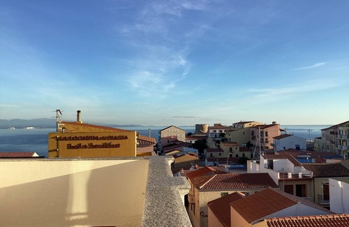 Santa Teresa di Gallura Apartment | Seaview cozy penthouse 300m walk to the beach, large terrace. Center Village.